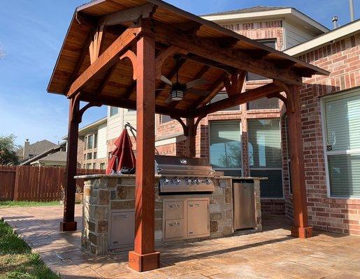 Extended patio, pergola, and outdoor kitchen.