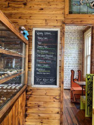 Menu, some of the seating, cupcake display