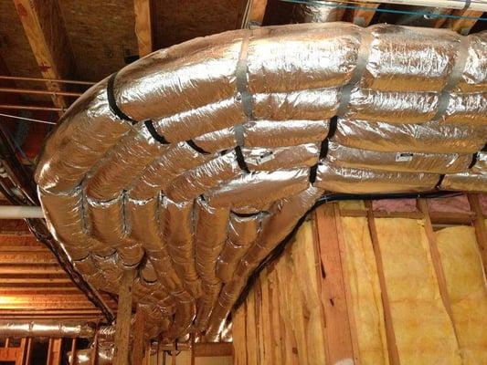 Duct runs going around a corner of customer house in Plano