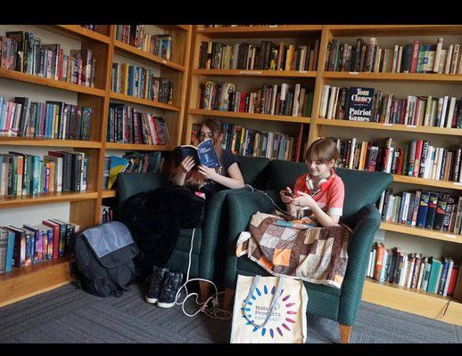 There is a well stocked library and cozy spots to sit and read.