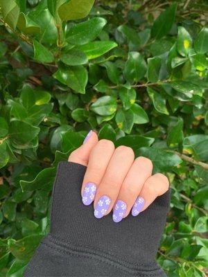 lavender gel nails with painted flowers :) this is from my most recent visit there and it's my absolute favorite !!