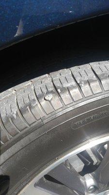 Screw in tire which they were able to remove and successfully repair. No replacement!