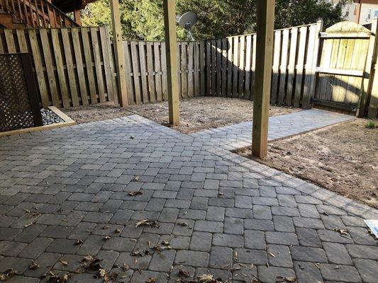 our new backyard, which used to be a weed jungle.  pro deck placed stones and lattice work around our ugly AC unit which was a nice touch.