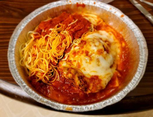 Veal Parmigiano with Angel Hair pasta.   Most of the red in this photo is actually cheese and grease that cooked off the cheese and veal.