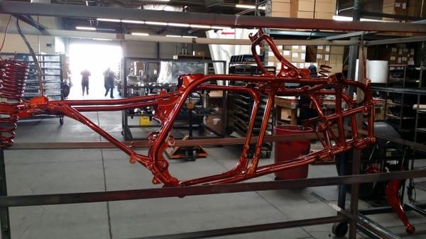 Motorcycle frame coated sparkle red.