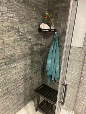 A newly installed tile shower wall