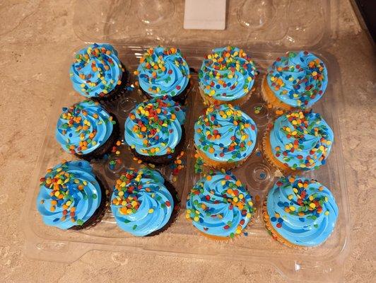 Custom ordered cupcakes (half white and chocolate cupcakes, blue whipped icing, with barbarian cream inside)