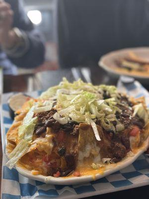 Nachos with brisket chili -- truly fantastic, didn't take the greatest photos but the cheese pull was *chef's kiss*