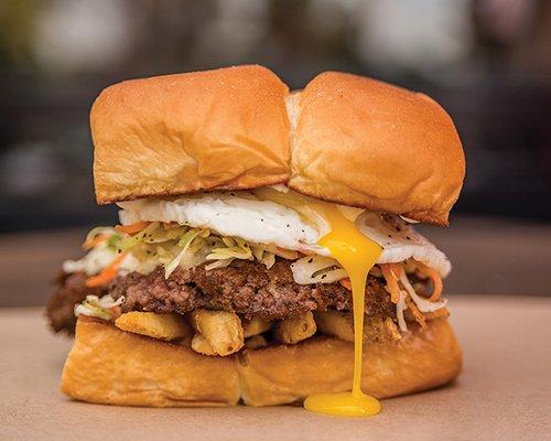 THE FREIBURGER¨ - white american cheese, fries, haus slaw, fried egg, mayo