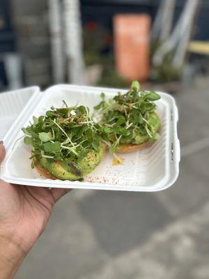 Avocado and greens bagel