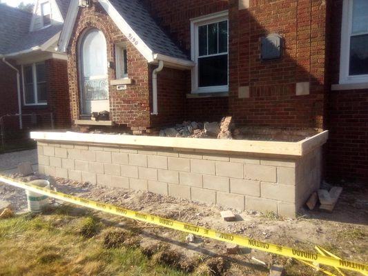 Tore out the old porch the customer wanted new porch in cinder block. Formed porch cap and steps for cement