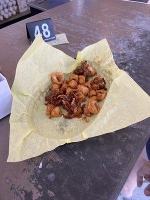 $17 worth of calamari that was way over cooked & fishy. This is how they say it down in front of us... it doesn't even look appetizing.