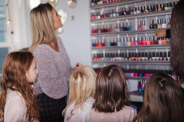 my daughters and friends picking out nail polish