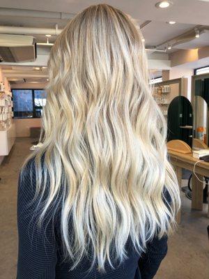 Babylights and textured long layer haircut on a natural dirty blonde with grey