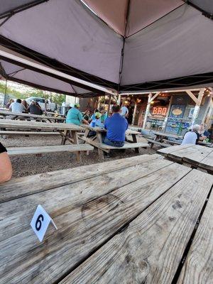 Comfortable outdoor patio area with washer games and cornhole boards.  Fun Fun Fun!