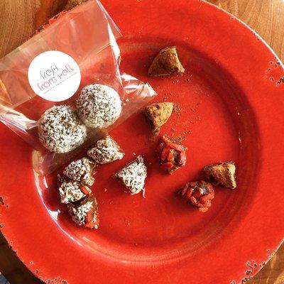 Merenda Treats! Coconut, almonds and dates mixed into a delicious ball covered in coconut flakes or cacao powder.