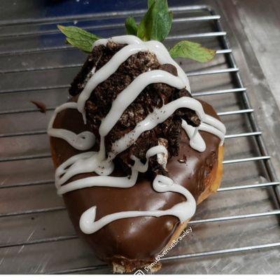 Chocolate covered organic STRAWBERRY donut with or without cream filling with oreo topping.