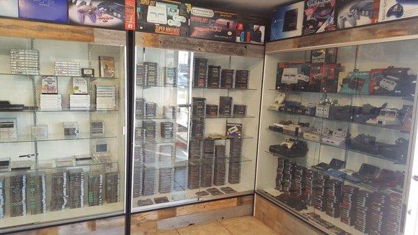 Nice selection of PS One, NES, SNES, Genesis, Master System consoles and games.