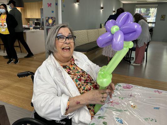 A participant shows off her balloon flower at the PACE Concord Center during Spring Fest 2024.