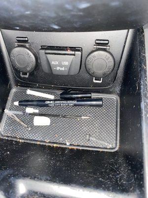 Broken pen, obviously used on the mirror and to remove the tab for the gear shift access.