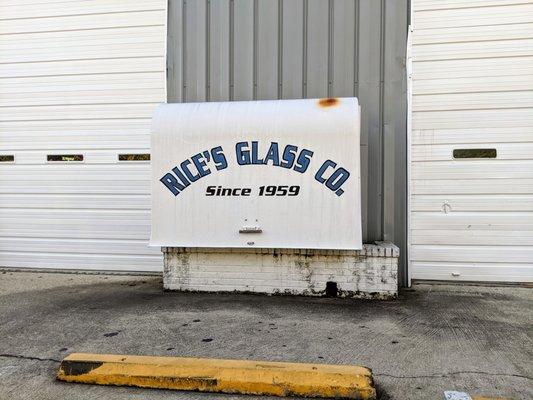 Outside the big garage doors. Rice's Glass Co. Since 1959.