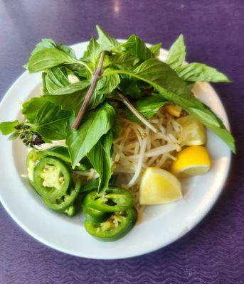 Bean sprouts, basil, jalapeños and lemon wedges