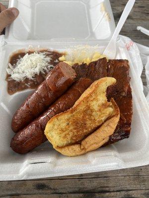 Two meat  plate with ribs and sausage mac and cheese and red beans and rice  . Was delicious and full of flavor