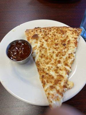 The slice of Crab Rangoon Pizza. Very bland and crust undercooked. The sweet chili sauce was super spicy. No balance.