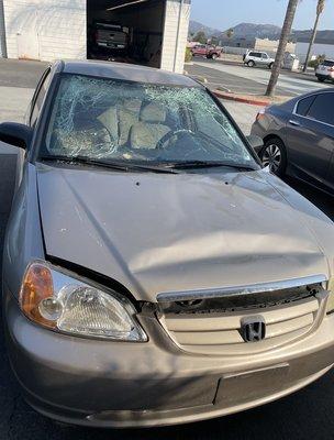 my car before and after :) he got the dent out the top of the car so the windshield could fit nicely