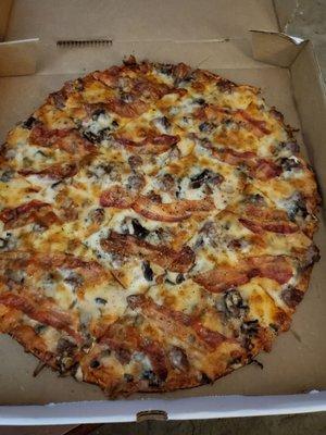 Large pizza with hamburger, bacon, mushrooms, light sauce, thin crust. Delicious!!!