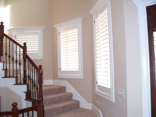 Custom color matched and direct mounted Wood Shutters with 3 1/2" Louvers.