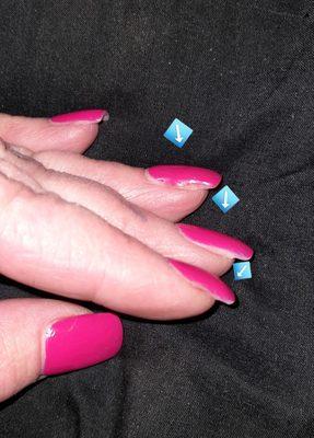 Arrows are pointing to the shape of nails & polish job.