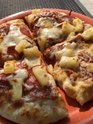 Personal pizza with pepperoni and pineapple