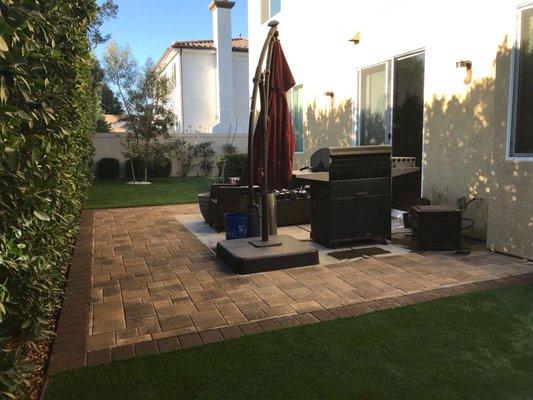 Custom Pavers and Artificial Grass area in the backyard