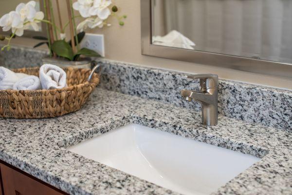 Undermount sink and brush nickel faucet supplied and installed by Sanford Granite