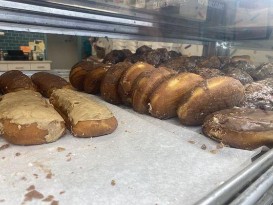 Maple-iced long-johns and chocolate-iced donuts with angel cream.