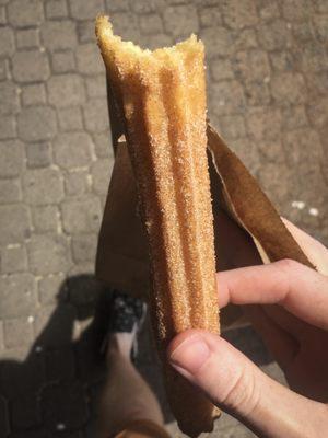 What seems to be a plain churro ends up being a cream-filled one!