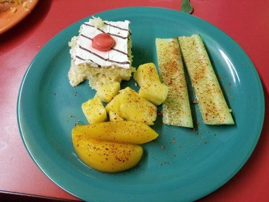 Fruits. Tres leche cake. Cucumbers.