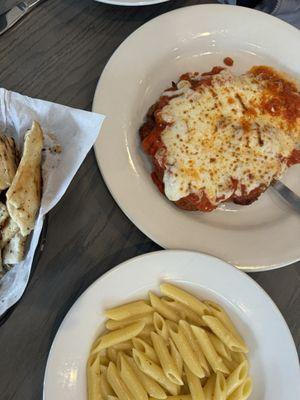 Chicken Parmigiana and side of Meatballs and pasta