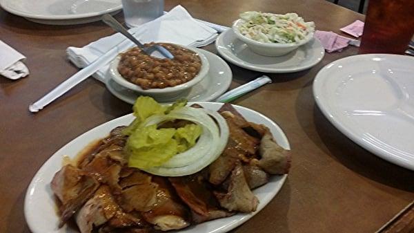 Double meat of pork and brisket - probably steamed not real bbq, dry cabbage with little dressing & probably canned pork & beans.