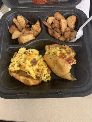 Stuffed croissant with bacon cheese scrambled eggs and potatoes