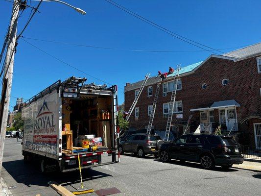 Shingle roofing project in Queens, unloaded and getting busy! - Royal Renovators Inc.