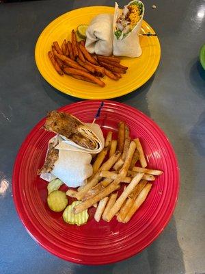 Yellow plate, Baja Wrap with sweet potato fries. Red plate, BBQ pulled pork with mozzarella wrap with fries.