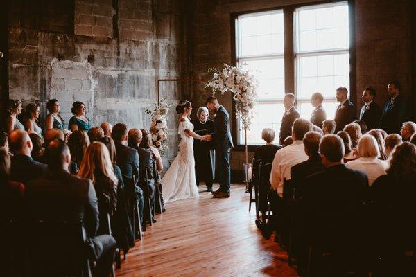 Bride and groom at wedding ceremony at Olio modern industrial event space north of Boston Massachusetts, New England