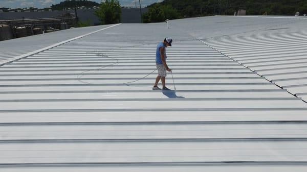 Clifford in action spraying a 50sq roof