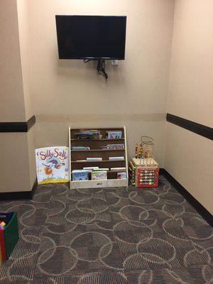 The books and toys in the Pediatric Neurologist waiting room.