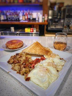 Corned beef hash, honey glazed donut, and a glass of rosé.