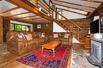 The Great Room at 3 bedroom log cabin Aspen Hideout: wood stove, hot tub, Internet.