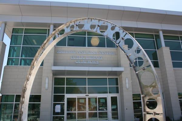 The west entrance of the Richard and Gina Santori Public Library of Aurora.