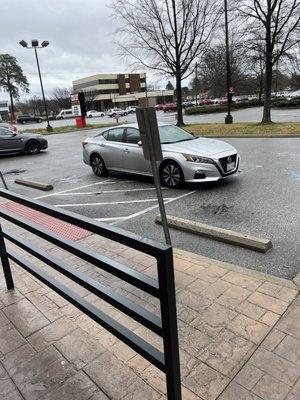 Employee parking in both handicapped spots